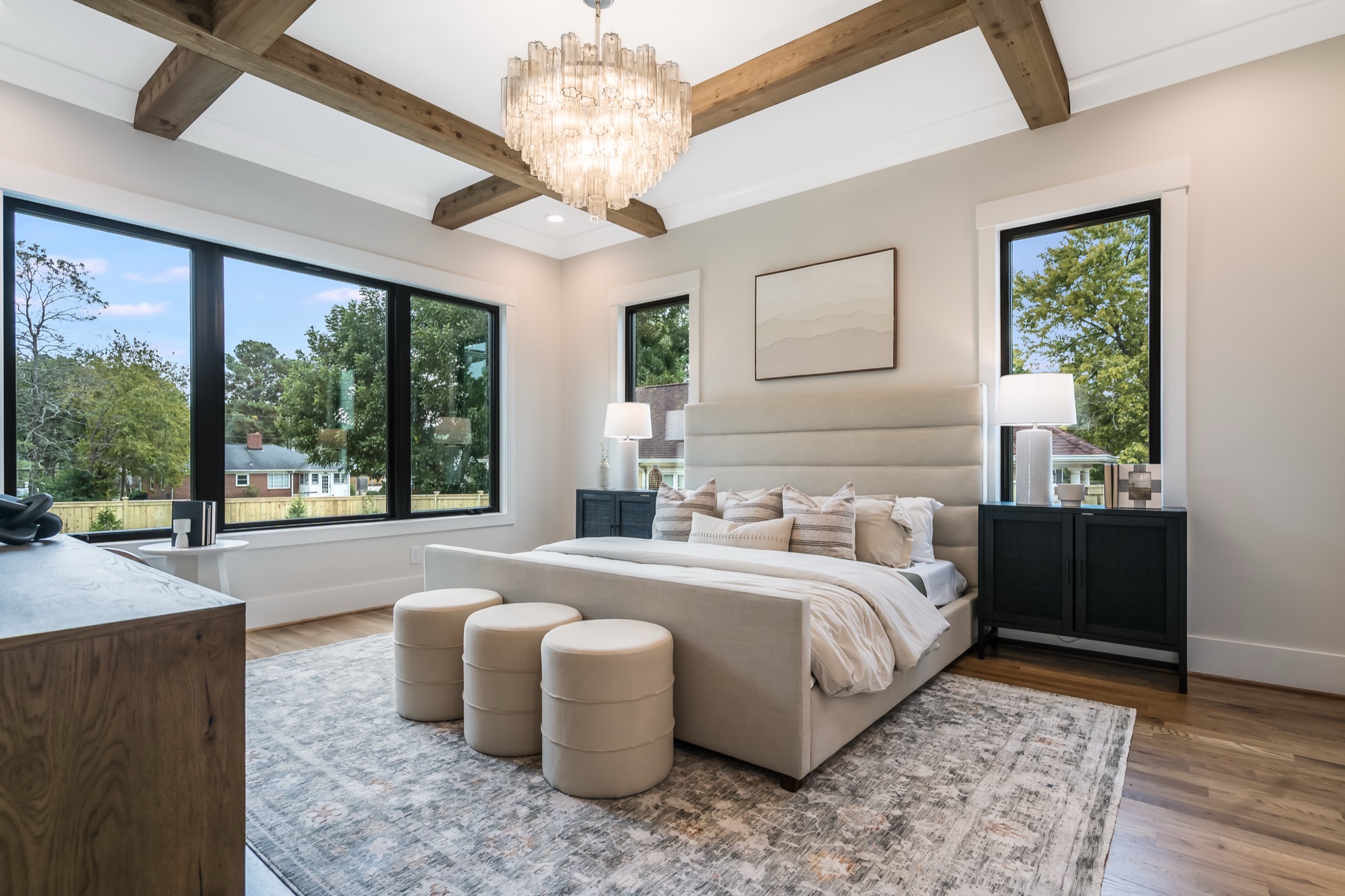 Master bedroom with coffered ceiling and natural light, the destination after the build