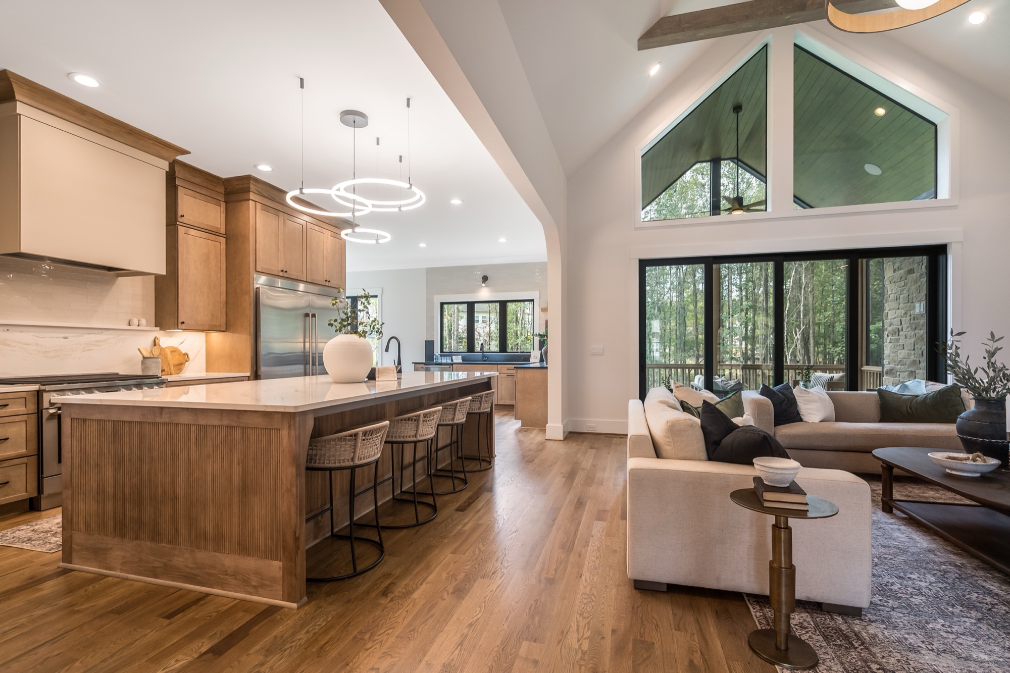 Open-plan kitchen and family room with vaulted ceiling